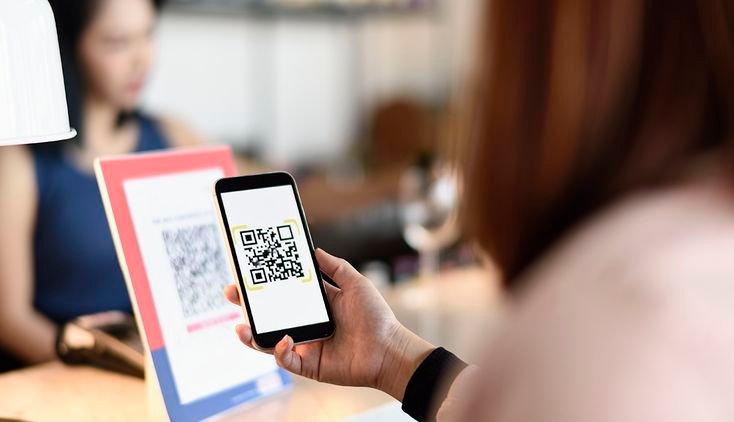 QR code being scanned at an event entrance